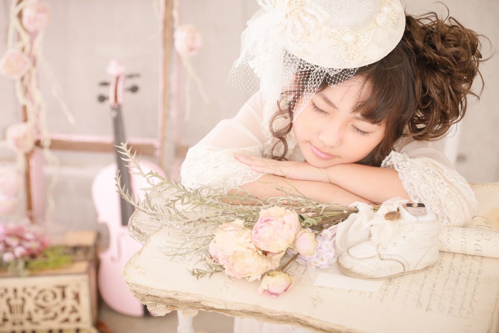 Yune sleeping in a Bohemian photoshoot