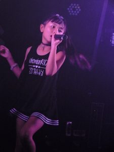 Yune Sakurai singing (looking a little like Ariana Grande)